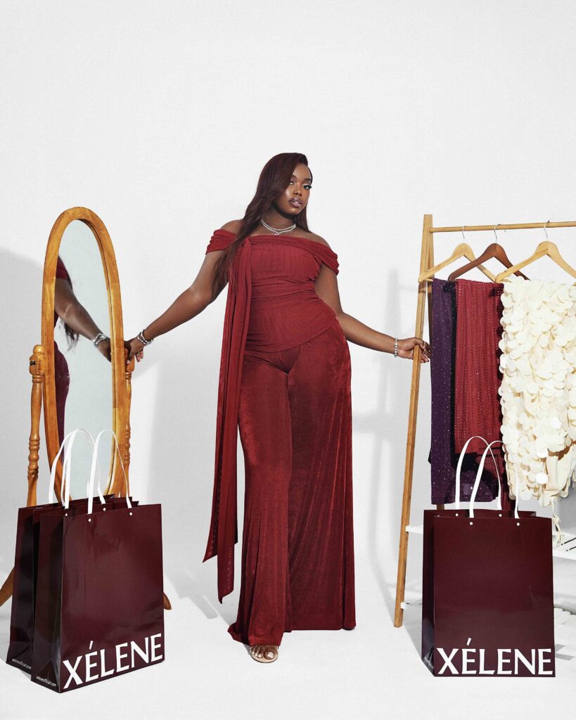 Woman in deep red Bardot two piece set with wide leg trousers at brunch, XELENE HANNIFA