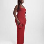 Woman wearing Scarlet, a fitted red 3D flower halter neck pencil dress by XELENE. Floor-length with back slit.