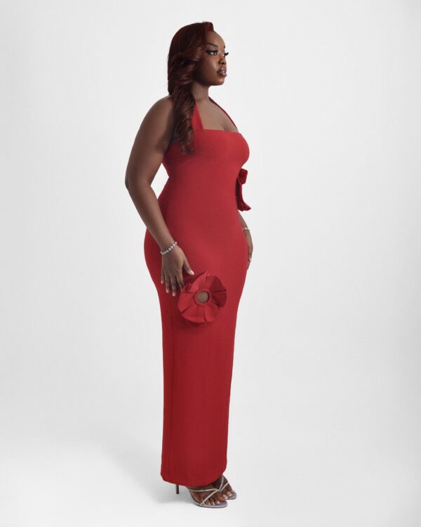 Woman wearing Scarlet, a fitted red 3D flower halter neck pencil dress by XELENE. Floor-length with back slit.